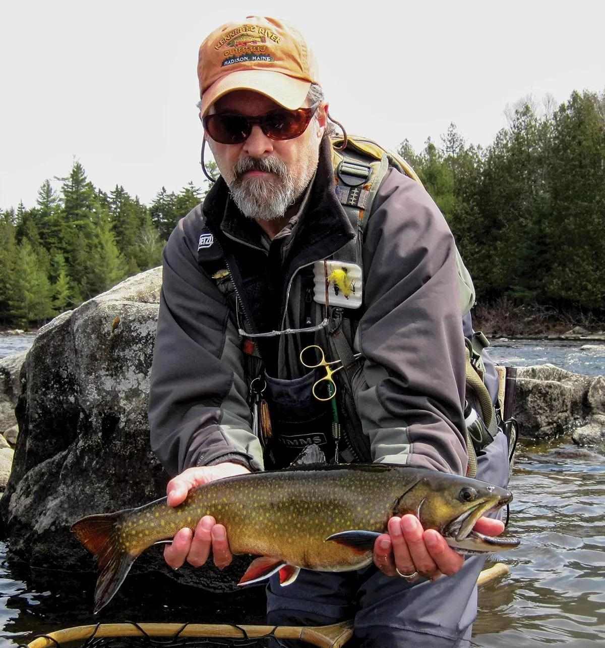 Bob Mallard holding a large brook trout.