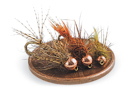 Three Bird's Nest nymph flies on a penny.