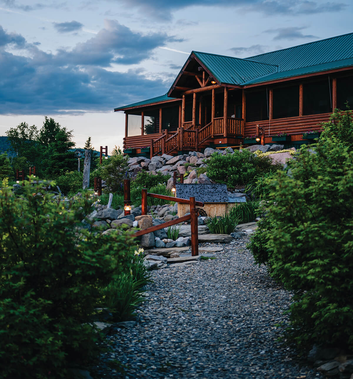 The facade and porch of the Restigouche River Lodge